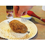 Applying potato seasoning by hand