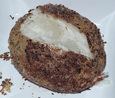 A fully baked potato with Spud Spikes Potato Seasoning