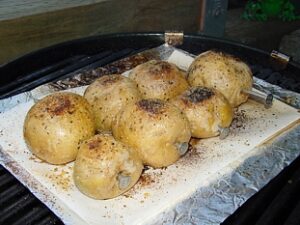 Potatoes cooked on BBQ while camping and RVing.
